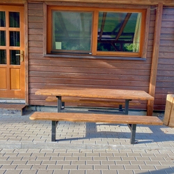 Outdoor seating arranged by the cabins for the summer comfort of guests